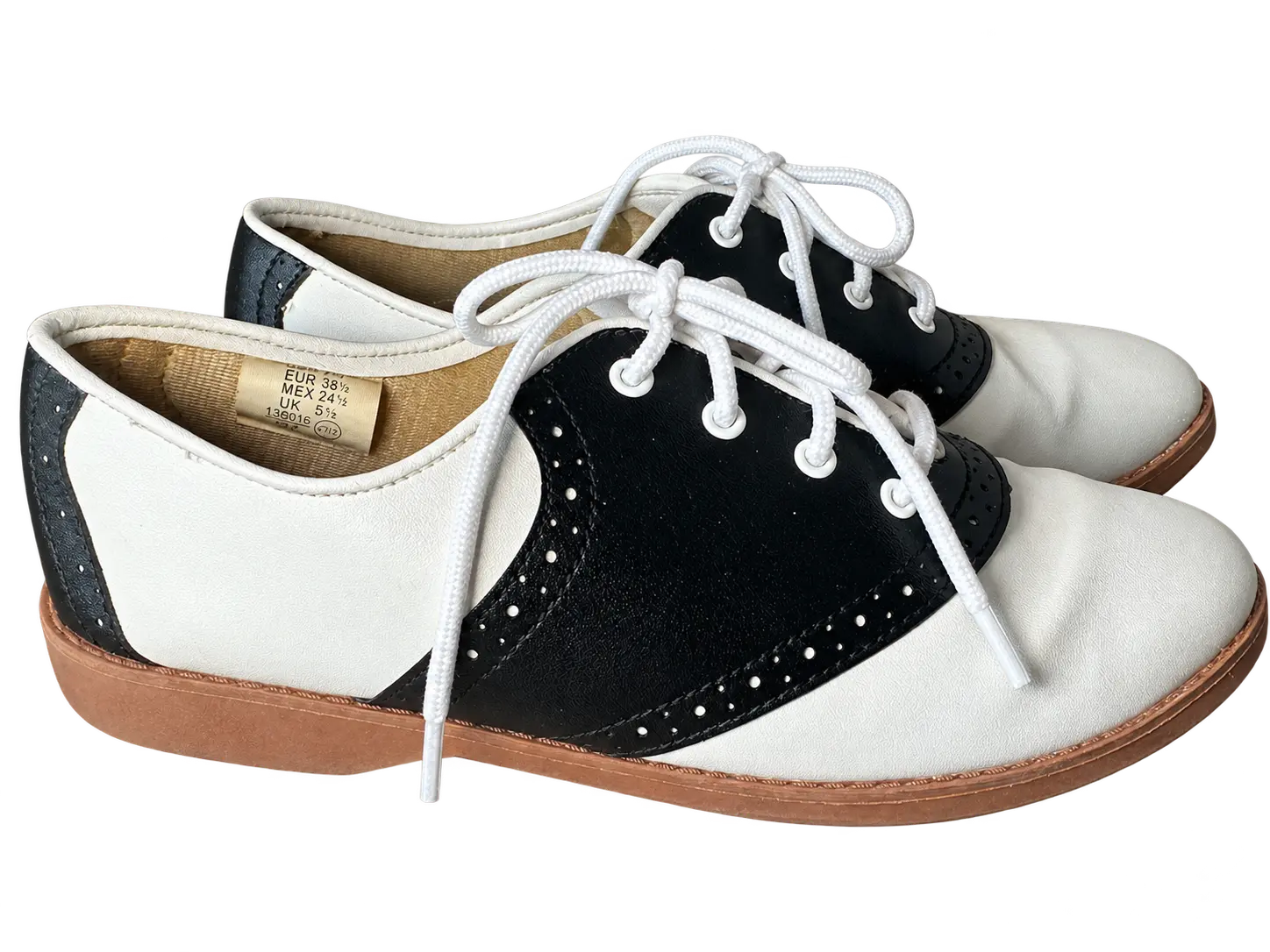 Freshly cleaned black and ivory Predictions lace-up oxfords from the side, with background removed