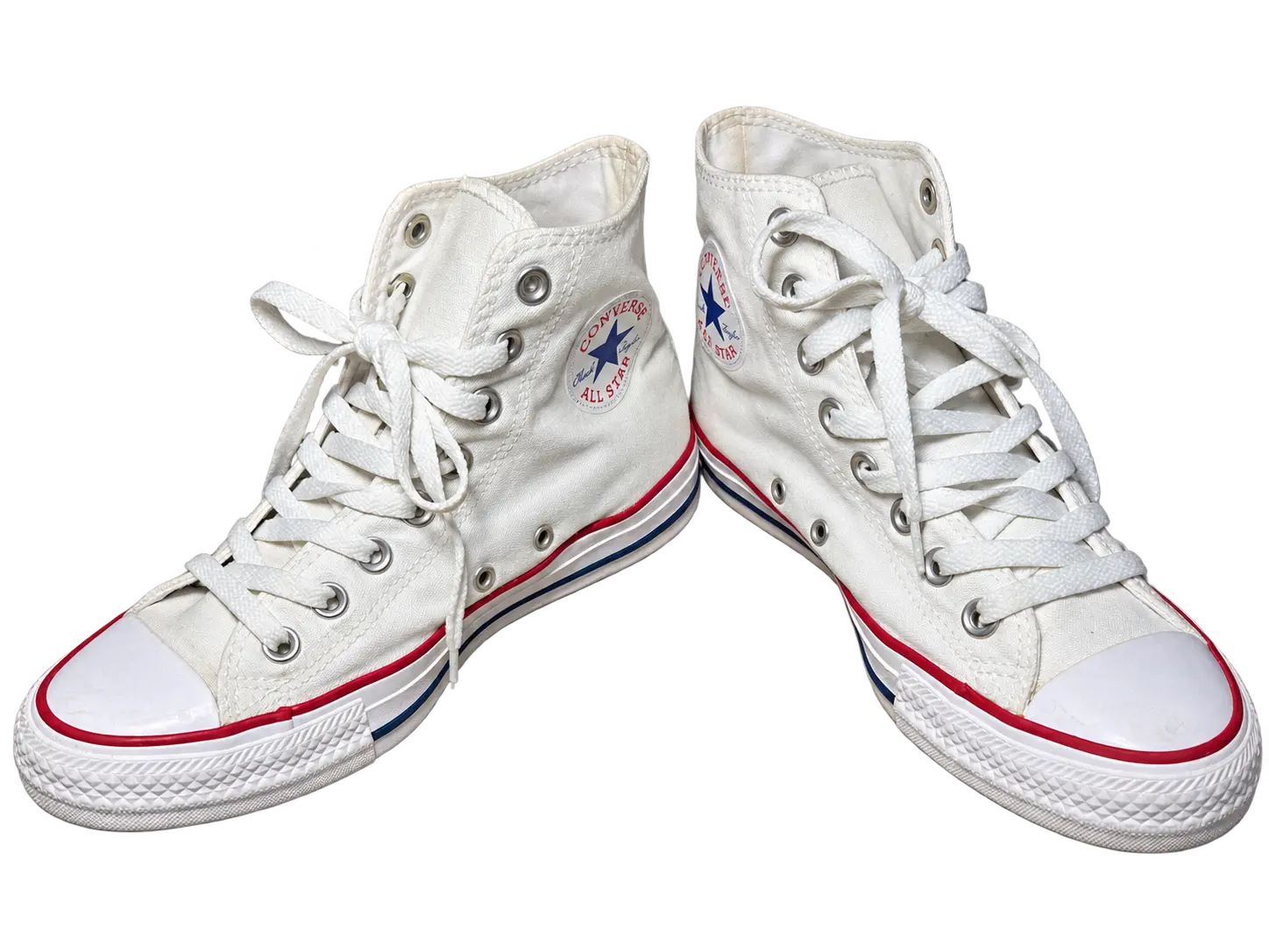 Background-free angled pair of white Converse high-top sneakers
