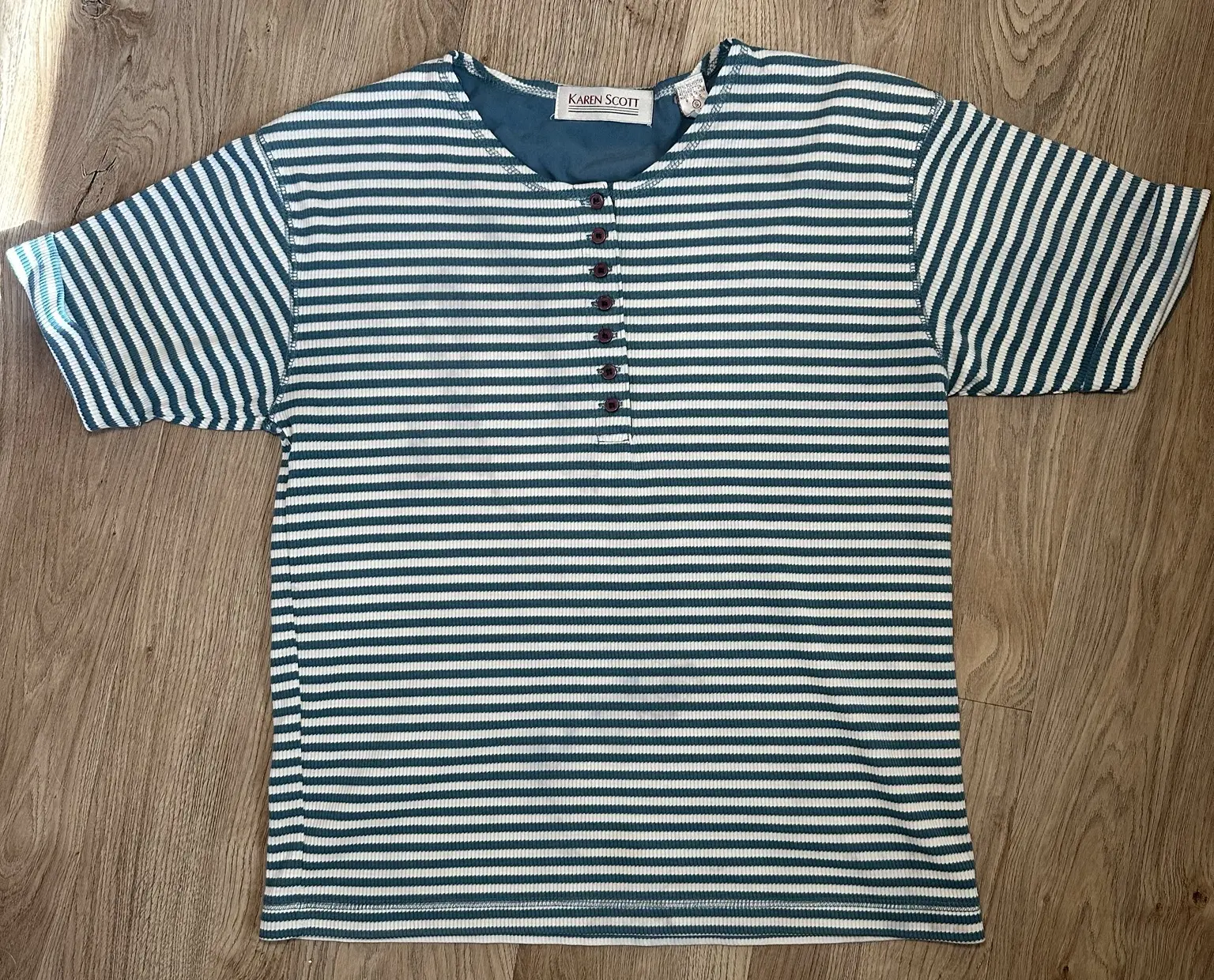 Front of teal and white striped Karen Scott short-sleeve henley top