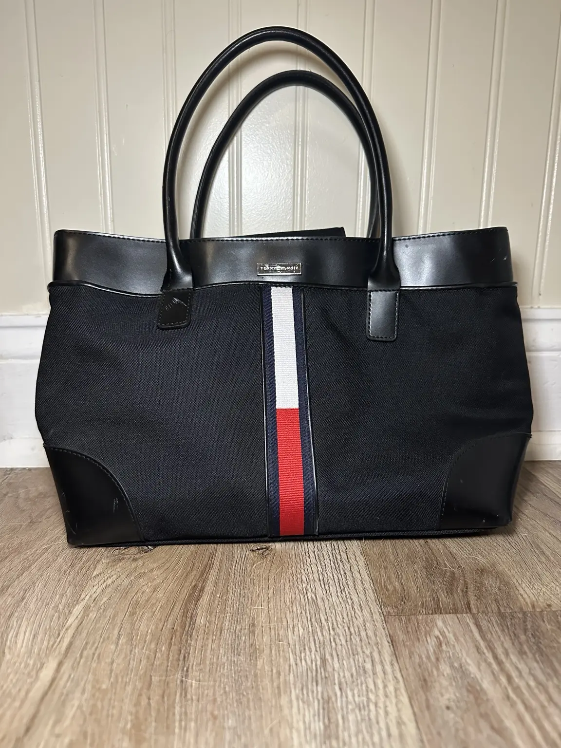Black Tommy Hilfiger structured tote with navy, white and red vertical stripe