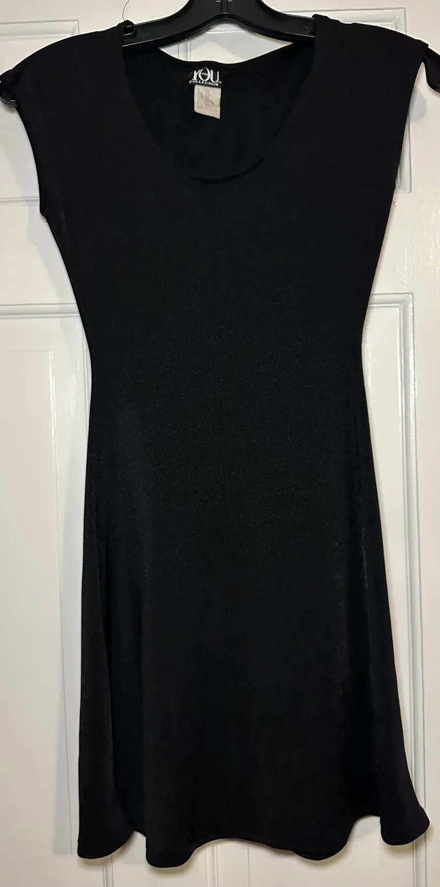 Black sleeveless YOU Collection dress with scoop neckline and gently flared hem
